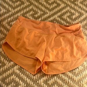 Orange lululemon speed up shorts